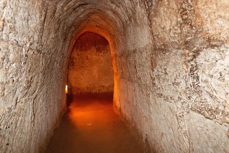 Inside a lit section of the Cu Chi tunnels
